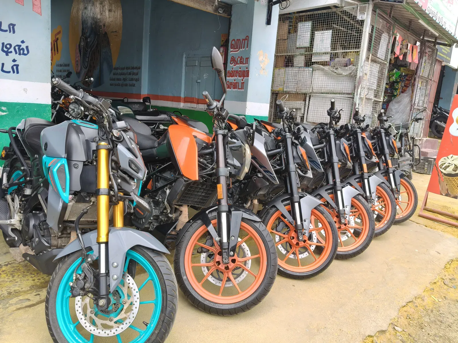 Line of motorcycles parked outside the showroom