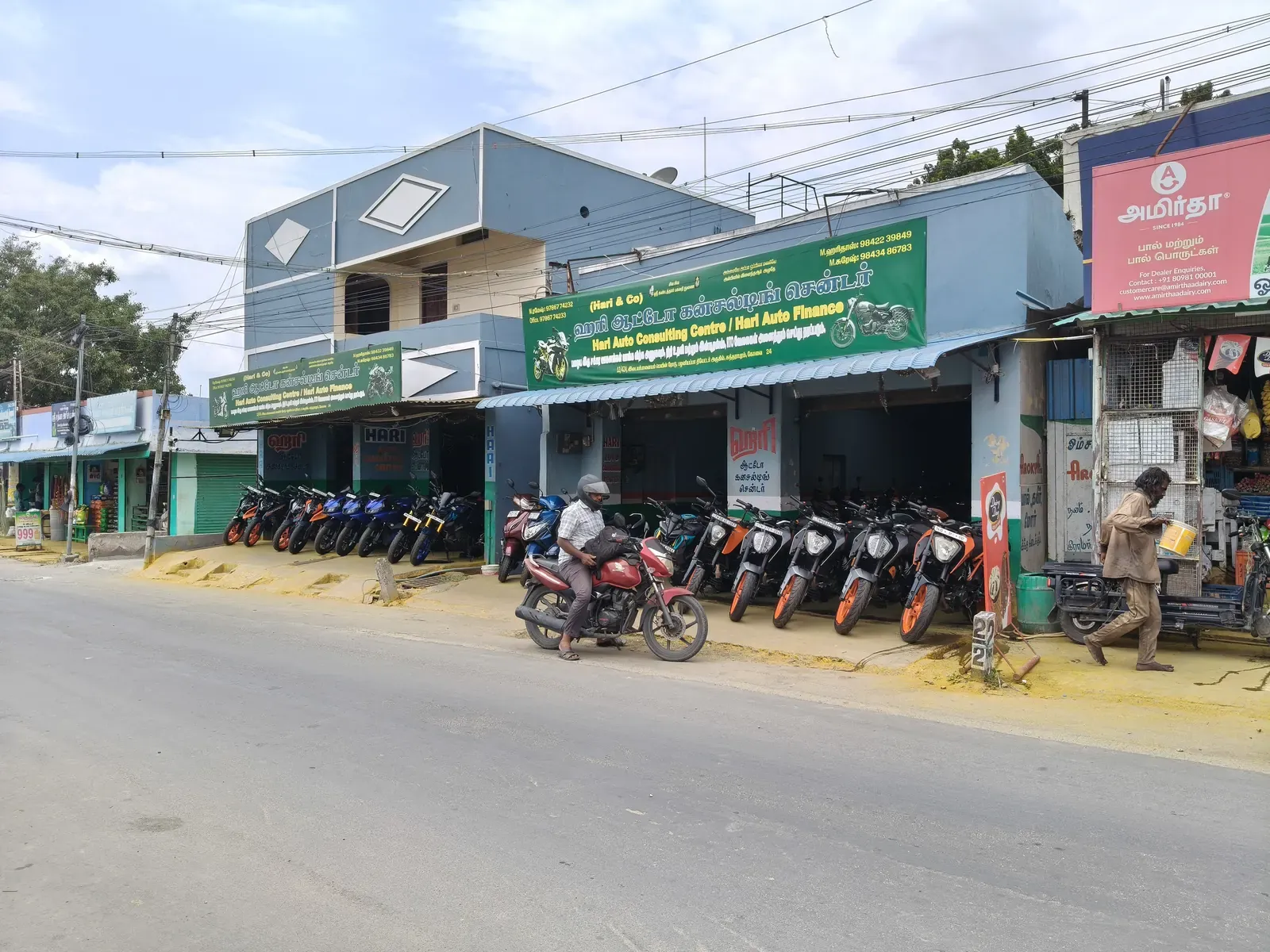 The HARI AUTO showroom building seen from across the street